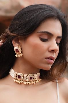 925 silver gold plated choker with white and red stone studded patterns, pearl drops and bead side chains. Comes with matching pair of earrings. - Aza Fashions White Gemstone Jewelry For Festivals, Traditional Pearl Drop Choker, Festive White Ruby Jewelry, Festive Pearl Chain Choker, Festive Red Pearl Chain Jewelry, White Ruby Temple Jewelry, Pearl Pendant Jewelry For Festive Occasions, Elegant Jewelry With Detachable Pendant For Festivals, Fine White Jewelry For Festive Occasions