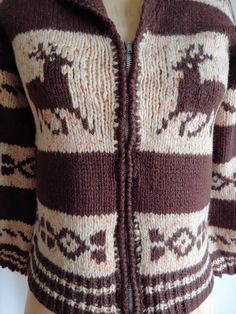 "A very rare 40s handknit wool cardigan with a reindeer motif Dark cocoa brown and ecru with hints of orange Shawl collar Metal zipper Not a heavy weight sweater Wider sleeves Handknit Bust - 34\" Hem - 34\" Sleeves - 15 1/2\" Cuff of sleeve across - 5\" Length - 21\" from back of collar to hem Excellent vintage condition Fresh and clean, ready to wear" Handmade Brown Winter Outerwear, Brown Hand Knitted Winter Outerwear, Cozy Brown Cardigan With Fair Isle Pattern, Cozy Brown Fair Isle Pattern Cardigan, Brown Fair Isle Pattern Winter Cardigan, Cozy Brown Outerwear With Fair Isle Pattern, Orange Shawl, Cocoa Brown, Metal Zipper