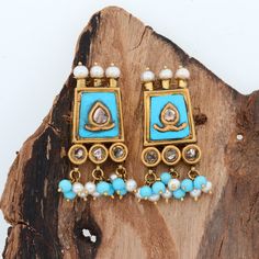 These earrings are a masterful fusion of traditional craftsmanship and natural beauty. Handcrafted in 22k yellow gold, turquoise pearls and Polki Diamonds come together in a harmonious union that celebrates the raw, organic charm of the turquoise. Each irregularity and imperfection in the stone is a testament to its natural origin, adding a layer of depth and character to the piece. Let these earrings adorn your ears and transport you to a world of timeless elegance and earthy sophistication. Tu 11th Wedding Anniversary, Earrings Kundan, 22k Gold Earrings, Diamonds Earrings, Kundan Jewelry, Beads Earrings, Earrings Pearl, Kundan Jewellery, Jewelry Cleaner