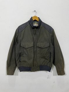 "*ITEM: Vintage Henry Cotton Classic Corbridge Wax Jacket Large Casual Jacket Green Like Barbour Harrington Waxed Coat Bomber Jacket Size L *ITEM DETAILS: 👇🏻 Please be aware that all vintage items will usually show a few signs of wear or fading due to age, but anything visible such as stains or holes, and serious flaws have been photographed.For any further information on this item please contact us and we will be happy to help. *SIZE: LARGE *ACTUAL SIZE MEASUREMENT: 👇🏻 *PIT TO PIT(WIDTH):25 Classic Biker Jacket With Pockets For Outdoor, Vintage Khaki Outerwear For Outdoor Activities, Fall Windbreaker With Flap Pockets For Outdoors, Fall Outdoor Utility Jacket With Stand Collar, Khaki Track Jacket For Outdoor Fall Use, Fall Outdoor Windbreaker With Flap Pockets, Vintage Olive Utility Jacket For Fall, Winter Cotton Biker Jacket With Pockets, Vintage Outerwear For Fall Outdoor Activities