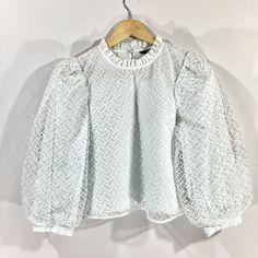 "Quirky puffball sleeve top, by Zara. The Top is made from a delicate semi-sheer embroidered fabric layer over an internal top that has a  eye subtle mint green colour. With puffball sleeves and a nigh ruffled neckline. Button Fastening. In good condition. Measurements Bust: 36\" Length: 19\"  Sleeves: 19\"" Party Cropped Tops With Blouson Sleeves, White Cropped Padded Blouse, Spring Lace Top With Lantern Sleeves, White Party Top With Blouson Sleeves, Padded Blouse With Balloon Sleeves For Brunch, Balloon Sleeve Padded Blouse For Brunch, Spring Lantern Sleeve Lace Top, White Fall Balloon Sleeve Top, White Lantern Sleeve Party Tops