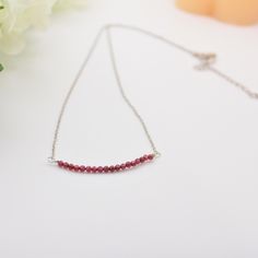 Garnet Properties: Protection ✨ Friendship ✨ Trust ✨  Sizes Available: 15" choker length. 18" standard necklace length. 20" length. 22" length. 24" length. Closure Metals Available: Stainless steel. 18K gold filled. Materials:  3 mm garnet beads 2.5 extender chain in stainless steel or 18k gold filled. Lobster clasp and chain in stainless steel or 18k gold filled. Tarnish-resistant beading wire. Shipping I ship each item individually within 1-3 days. Free Shipping on $35+ orders. Ground shipping Red Minimalist Necklace With Delicate Chain, Minimalist Red Necklace With Delicate Chain, Red Choker With Adjustable Chain For Gifts, Red Choker With Adjustable Chain As Gift, Red Adjustable Chain Choker As Gift, Red Choker Necklace For Gift, Dainty Red Necklace For Anniversary, Adjustable Red Dainty Necklace, Dainty Adjustable Red Necklace