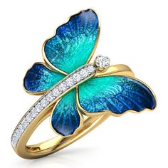 a blue butterfly ring with diamonds on the bottom and wings, set in yellow gold