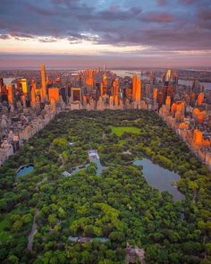 an aerial view of the central park in new york city, ny at sunset or dawn