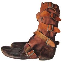 Worlds End Strap Boots Vivienne Westwood / Malcolm Mclaren 1982-1983 | From a unique collection of rare vintage Shoes at https://www.1stdibs.com/fashion/accessories/shoes/. Vivienne Westwood Boots, Malcolm Mclaren, 1930s Shoes, Worlds End, Century Shoes, Strap Boots, Orange Sandals, Shoes World, Jeweled Sandals