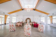 a room filled with lots of tables and chairs