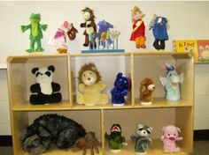 several stuffed animals are sitting on the shelf