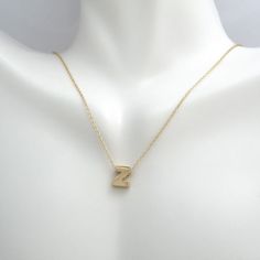 This pendant necklace is crafted in 14 Karat yellow gold. Featuring the letter "Z" on a adjustable necklace measuring 16 or 18 inches in length. Modern Yellow Gold Initial Pendant Necklace, Z Pendant, Z Necklace, Letter Z, Adjustable Necklace, Initial Necklace, Necklace Gold, Free Gifts, Initials