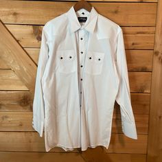 Nwot - This Shirt Has Been Starched And Is Ready To Roll. The Tags Were Taken Off And We Took It To Get It Starched And Never Wore It. Exclusive, Private Label White Horse Apparel From Centerville Western Wear In Centralia, Washington. Darling Black Buttons Add A Lot Of Character To This Basic White Button Down Western Shirt. Bundle More Items To Save Big! Western Long Sleeve Tops With Snap Buttons, Western Long Sleeve Shirt With Button Closure, Classic Long Sleeve Tops For Rodeo, Western Long Sleeve Top With Button Closure, Classic White Shirt With Buttons, White Long Sleeve Shirt With Button Closure, White Long Sleeve Buttoned Shirt, White Long Sleeve Shirt With Buttons, Western Snap Button-up Shirt