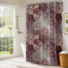 a bathroom with a bathtub and shower curtain that has red roses on it in front of a window