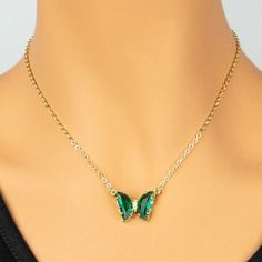 Shine in this playful acrylic butterfly necklace. Features transparent gem tone wings with crystal sparkle body. Measures 16" + 3" extension.Butterfly .5" x .75" Trendy Butterfly Necklaces For Party, Green Butterfly Charm Necklace, Adjustable Butterfly Charm Necklace For Party, Crystal Butterfly Charm Necklace, Butterfly Charm Necklace For Party, Acrylic Butterfly, Gem Tones, Global Village, Butterfly Pendant Necklace