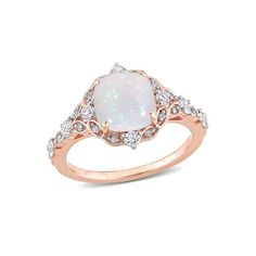 a white opal and diamond ring