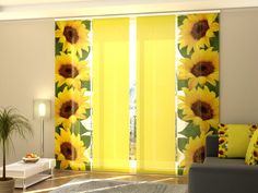 a living room with yellow curtains and sunflowers