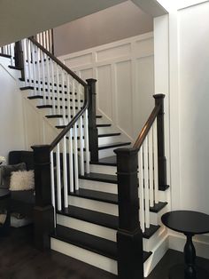 there is a black and white staircase in the house