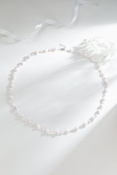 Baroque Freshwater Pearl Necklace with Pastel Beads Embrace youthful charm with our Baroque Freshwater Pearl Necklace, adorned with delightful pink and white beads. This necklace's playful colors evoke a sense of joy and beauty. Measuring 68cm with an additional 3cm extension, it offers versatility, allowing you to style it as a bracelet too. Perfect for casual wear, summer days, weddings, and travel, this necklace brings a fresh and vibrant touch to any occasion. Product Details: Pearl: Freshwa White Single Strand Necklace For Wedding, Pearl White Single Strand Necklace With Round Beads, Pearl White Faceted Beaded Necklaces, Long Single Strand Pearl White Necklace, Long Single Strand Beaded Necklace For Wedding, Elegant Pearl Crystal Necklace With Colorful Beads, White Long Pearl Chain Necklace, White Long Bridal Necklace Gift, Pearl White Beaded Necklaces With Round Beads