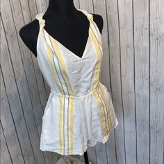 Dolci Vita Linen Romper With Yellow And Black Detail. Open Back, Button Neck Closure. Perfect Festival Piece. Nwot #Romper #Summer #Festival White Cotton V-neck Jumpsuits And Rompers, White Cotton V-neck Jumpsuit, Casual Yellow Cotton Jumpsuits And Rompers, Casual Yellow Cotton Jumpsuit, Spring Yellow Cotton Jumpsuits And Rompers, Yellow Cotton Jumpsuits And Rompers For Spring, Yellow V-neck Jumpsuits And Rompers For Vacation, Summer Cotton Jumpsuits And Rompers For Daywear, Yellow Fitted Cotton Jumpsuits And Rompers