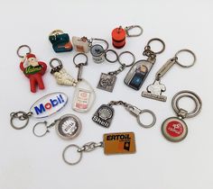 a collection of key chains with various types of items attached to them, all in different shapes and sizes