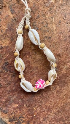 Natural Puka Shell Anklet & Bracelet This is a beautiful and genuine puka shell anklet or bracelet. Hand-crafted with natural shells, this necklace will bring delight to wear in any occasion. The shape and design makes it easy to match any attire that you own. Make it a complete set when you purchase different designs to go along with it.  Please note that because the shells are natural, size and color shade may vary slightly by piece. Casual Beach Jewelry With Cowrie Shell, Casual Cowrie Shell Jewelry For Beach, Casual Cowrie Shell Jewelry For Festivals, Casual Cowrie Shell Beach Jewelry, Beach Season Shell Jewelry For Festivals, Vacation Cowrie Shell Beaded Bracelets, Vacation Cowrie Shell Strand Bracelets, Shell Jewelry With Round Beads For Vacation, Adjustable Shell Necklace As Summer Gift