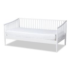 a white baby crib with a mattress on the bottom and side rails, in front of a white background