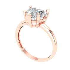 a rose gold engagement ring with an oval cut diamond in the center, on a white background