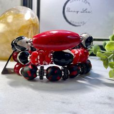 Bold Black Jewelry Gift, Bold Black Jewelry For Gifts, Bold Black Jewelry For Gift, Red Beaded Jewelry For Healing, Red Beaded Bracelets With Natural Stones As Gift, Red Spiritual Beaded Bracelets With Natural Stones, Spiritual Red Beaded Bracelets With Natural Stones, Red Agate Bracelets With Gemstone Beads, Artisan Red Jewelry With Gemstone Beads