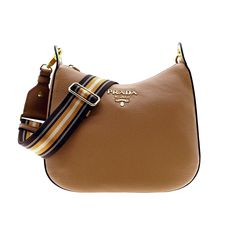 This Classic Crossbody Bag From Prada Is Crafted From Supple Brown Vitello Phenix Leather, Finished With The Signature Prada Logo Plaque With Gold-Tone Hardware. Featuring A Dark Brown, Tan, And Cream Web Striped Strap, This Versatile Bag Can Be Adjusted To Your Preferred Strap Length. The Spacious Interior Includes One Interior Zip Pocket And One Interior Slide Pocket With A Magnetic Snap Closure. Elevate Your Look With This Chic And Minimal Crossbody, Only From Prada. Model: 1bc166 Caramel Bro Prada Nylon Crossbody Bag, Classic Crossbody Bag, Nylon Crossbody Bag, Bags Prada, Prada Nylon, Prada Model, Prada Logo, Caramel Brown, Prada Bags