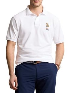 An American style standard since 1972, the Polo shirt has been imitated but never matched. Over the decades, Ralph Lauren has reimagined his signature style in a wide array of colors and fits, yet all retain the quality and attention to detail of the iconic original. This version is made of highly breathable cotton mesh, which offers a textured look and a soft feel, and is finished with the beloved Polo Bear.​​100% cotton Ribbed-knit collar2-button placketPolo Bear and "Polo" embroidered at the Classic White Polo Shirt, Polo Bear, Beach Club, Signature Style, American Style, Polo Ralph, Ribbed Knit, Polo Ralph Lauren, Polo Shirt