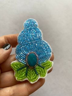 "Entirely beaded brooch on felt of a retro whimsical conch shell. Inspired by the great Schlumberger who made phenomenal one of a kind jewelry. Measures 3.5\" x 2\"" Handmade Bohemian Brooches For Collectors, Handmade Turquoise Brooches For Collectible, Unique Handmade Turquoise Brooch, Unique Handmade Turquoise Brooches, Unique Beaded Brooches For Crafting, Retro Whimsical, Handmade Pins, Conch Shell, Beaded Brooch