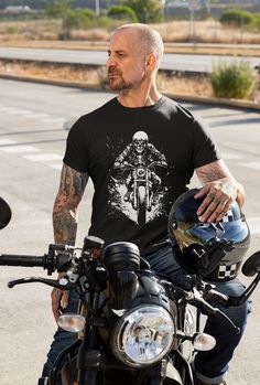 🏍️ Rev up your style with our striking black t-shirt! Featuring a bold black and white image of a skeleton on a motorcycle, this tee is perfect for motorcyclists who love to stand out. Whether you're hitting the open road or just cruising through town, this shirt combines edgy design with comfort. It's a must-have addition to any rider's wardrobe. Available in various sizes, this tee makes a great gift for motorcycle enthusiasts or a treat for yourself. Get ready to ride in style and showcase your passion for adventure with our skeleton motorcycle t-shirt! 🖤 .: There are no side seams. The collar is made with ribbed knitting to prevent curling damage.  .: All shirts feature a tear-away label for total wearing comfort.  .: Made using ethically grown and harvested US cotton. Punk Black T-shirt For Biker Events, Motorcycling Graphic Tee With Short Sleeves, Graphic Tee For Motorcycling With Short Sleeves, Black Biker Top With Skull Print, Biker Style Short Sleeve T-shirt For Streetwear, Cotton Biker Top For Biker Events, Biker T-shirt With Skull Print, Biker T-shirt With Skull Print In Cotton, Black Punk T-shirt For Biker Events