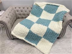 This amazingly beautiful blanket is hand knitted with BeCozi Chunky chenille yarn in Ivory and Misty green colors in Checkered pattern Size: 40x60 inches Perfect lap throw to cover your legs while sitting on a couch Perfect gift for yourself or your loved one! Make sure to watch our video on showing blanket sizes: https://youtu.be/yWoH0KmYMqw Chunky Chenille Blanket, Chunky Knit Blanket Pattern, Sitting On A Couch, Knitted Blanket Squares, Modern Crochet Blanket, Chenille Blanket, Hand Knit Blanket, Crochet Stitches For Blankets, Chenille Yarn