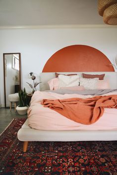 a bed with an orange circle above it