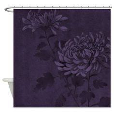 a purple flower shower curtain with leaves on the bottom and an image of two flowers in the middle