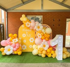 balloons are arranged in the shape of letters and flowers