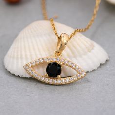 "★14K Solid Gold Evil Eye Necklace, 925 Sterling Silver Evil Eye Necklace, Black Evil Eye Necklace, Valentine's Day Gift, Mother's Day Gift★ ✔ FEATURES: -Gold KT: 14K Solid Gold and 925 Silver -Colors: 925 White Gold, 925 Rose Gold, 925 Yellow Gold, 14K White Gold, 14K Rose Gold, 14K Yellow Gold -Chain Lengths: 14\", 16\", 18\", 20\", 22\" -Chain Widths: 0.7mm -Chain Style: Box ✔ SHIPPING: -Ready to Ship in 1-3 Business Days -FREE shipping on all orders -Packed in a labeled gift box -The perfect birthday or holiday (Christmas, Hanukah, valentines day...etc.) gift! -We ship globally ✔ MY SHOP: Check out my shop https://www.etsy.com/shop/ErsJewelryDesign Or, Go Directly to My Sections: - Rings - https://etsy.me/3BsB1ei - Necklaces - https://etsy.me/3nDGV7C ✔ CARE INSTRUCTIONS: Providing high Black Clavicle Chain Charm Necklace, Black Sterling Silver Necklace, Gift For Her, Black Sterling Silver Necklace Gift For Her, Black Cubic Zirconia Necklace Gift, Black Cubic Zirconia Pendant Jewelry, Black Sterling Silver Necklace For Her, Black Necklaces With Birthstone For Anniversary, Black Pendant Necklaces For Anniversary, Black Birthstone Necklaces For Anniversary