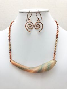 DESCRIPTION:  This unusual necklace features a stunning art glass tube as the pendant of the necklace. It has such a cool array of blue, orange, green and yellow colors. It reminds me of a painting! The art glass tube was combined with a copper chain that was hand-linked from copper jump rings and heat patinated to give the copper gorgeous iridescent colors that complement the art glass tube. The necklace is finished off with a copper toggle clasp (see the fifth photo).  This glass tube necklace Lampwork Glass Pendants, Gemstone Bar Necklace, Fused Glass Necklace, Unusual Necklace, Tube Necklace, Murano Glass Jewelry, Dichroic Glass Pendant, Opal Ring Gold, Fused Glass Pendant