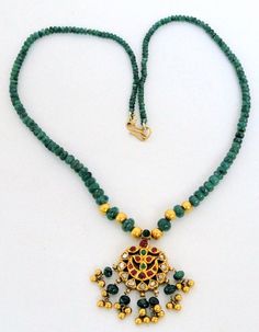 "Vintage antique solid 22 K gold Kundan work pendant necklace. Uncut diamond set with rubies and emeralds in very classic style strung with natural Emerald and gold beads. Total Length of necklace-46 cm(18 \") we can adjust length. size of only pendant-4/2.5 cm, total weight-25 grams(0.87 ounces), Net gold weight approx-15 grams(0.52 ounces)." Traditional Emerald Necklace For Gift, Traditional Round Emerald Necklace Gift, Temple Jewelry Style Emerald Pendant Necklace, Temple Jewelry Style Emerald Gemstone Necklace As Gift, Emerald Necklace For Gift In Temple Jewelry Style, Temple Style Emerald Gemstone Necklace As Gift, Hand Set Emerald Pendant Necklace For Anniversary, Emerald Necklace With 17 Jewels For Celebration, Emerald Gemstone Necklace For Gift, Temple Jewelry Style