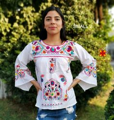 Well designed and well embroidery only for you. Mexican blouse embroidered flowers bell sleeve. This is a blouse embroidered by hand with beautiful colorful flowers. Very comfortable, Goes great with jeans, leggings, skirt, shorts... Each piece is unique and handmade with dedication and taking care of every detail achieving the best quality in our products, which is why it makes it beautiful and unique each of the embroidered flowers. More style, check the following link: https://www.etsy.com/mx Festive White Top With Embroidered Sleeves, Festive White Blouse With Embroidered Sleeves, Traditional White Long Sleeve Top, Folk Style Long Sleeve Embroidered Top With Motif, White Long Sleeve Tops With Intricate Embroidery, Folk Style Long Sleeve Tops With Motif, Spring Motif Long Sleeve Blouse, White Long Sleeve Blouse With Intricate Embroidery, Spring Long Sleeve Blouse With Motif