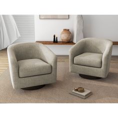 two chairs sitting next to each other on top of a rug