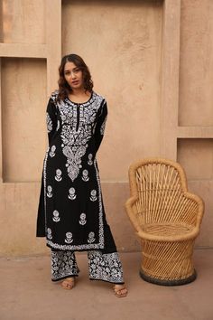 Floral Black Chikankari set, Chikankari Kurta Pant Set, Handmade Lucknowi Chikankari Kurti Casual Wear, Minimal look Kurta boho Fashion Introducing our stunning Black and White Chikankari Kurti and Palazzo Set--a captivating ensemble that seamlessly marries the classic elegance of monochrome with the intricate craftsmanship of Chikankari embroidery. Elevate your ethnic wardrobe with this timeless creation that exudes sophistication and charm for any occasion. Immerse yourself in the artistry of Chikankari embroidery, where skilled artisans have handcrafted every inch of this set with precision and care. The white Chikankari work intricately adorns the black canvas, creating a mesmerizing contrast that is both bold and graceful. The black and white color combination is a timeless choice, of Bohemian Palazzo Set With Zari Work, Traditional Long Sleeve Pant Set With Zari Work, Bohemian Mulmul Sharara With Block Print, Festival Palazzo Set With Straight Kurta And Chikankari Embroidery, Traditional Long Sleeve Pant Set, Semi-stitched Full Length Sets With Resham Embroidery, Traditional Long Sleeve Block Print Palazzo Set, Eid Full Length Zari Work Set, Traditional Full Length Sets For Diwali