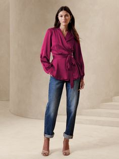 We selected a soft and fluid satin fabric for this tailored top, enhanced with ruched accents across the shoulder and bust.  Semi-fitted.  V-neck.  Crossover-button front.  Unlined.  #850998 Semi-fitted.  Long sleeves.  Hip length.  Model: Size S, 5' Formal Long Sleeve Ruched Tops, Chic Ruched Tops For Work, Chic Ruched Silk Tops, Chic Formal V-neck Wrap Top, Elegant Wrap Top With Surplice Neckline For Work, Elegant Surplice Neckline Wrap Top For Work, Ruched Formal Top For Spring, Formal Ruched Top For Spring, Spring Formal Ruched Top