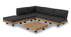 an outdoor sectional sofa with coffee table and footstool in front of white background