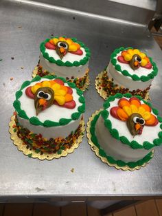 there are four cakes decorated with turkeys on them