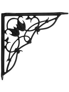 an iron shelf bracket with flowers and leaves in the center, on a white background