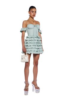 cuz they will never love another. This fit and flare dress has a twill construction, structured boning, an off-the-shoulder neckline with attached sleeves, a tiered ruffled skirt, a ruched back, a self-tie front closure, and a back hook and zipper closure. Off-shoulder Mini Dress With Ruffles For Cocktail, Green Ruffled Mini Dress For Evening, Green Ruffled Evening Mini Dress, Fitted Green Mini Ruffle Dress, Fitted Green Ruffle Mini Dress, Flirty Green Mini Dress With Ruffles, Chic Green Mini Dress With Ruffles, Fitted Green Tiered Dress, Spring Cocktail Off Shoulder Dress With Ruffles