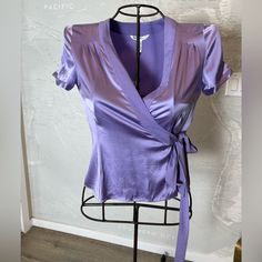 New With Tags. Wrap Blouse In Silk Satin. Include This Wrap Blouse From Diane Von Furstenberg In Your Closet To Add Color To Your Mundane Formal Wears. Crafted With Vibrant Lavender Silk, This Lovely Blouse Comes With A With A Self Belt-Tie At The Side. Diane Von Furstenberg Wrap Blouse In Lavender Silk Material: Silk Stretch Lavender Silk, Belt Tie, Purple Violet, Silk Material, Wrap Blouse, Von Furstenberg, Diane Von, Diane Von Furstenberg, Silk Satin