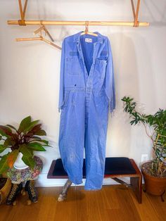 Vintage sky blue denim jumpsuit with a baggy/oversized fit for a S/M wearer. The denim is distressed with fading and frays throughout which adds to its worn in appearance. I like this piece because its incredibly simple and utilitarian- perfect to throw on in the fall with some cool boots and a tote bag or something- however, its also a bit of an eye-catcher because of the color. Incredibly comfy. Light Wash Cotton Denim Jumpsuit With Frayed Hem, Light Wash Denim Long Sleeve Jumpsuit, Medium Wash Distressed Denim Jumpsuit, Distressed Denim Jumpsuit For Fall, Distressed Overalls For Fall, Cotton Overalls With Frayed Hem, Medium Wash Denim Jumpsuit With Frayed Hem, Denim Blue Jumpsuit With Frayed Hem, Fall Medium Wash Distressed Denim Jumpsuit