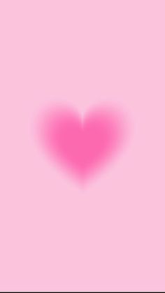 a pink heart shaped shadow on a pink background with the word love written below it