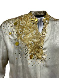 Gorgeous Sparkly Latin Dance Shirt that fit size M-L BENEFITS: -This golden and shiny Latin shirt ensures that you will turn heads on the stage. -The Golden color is very striking and combines well with different colors of pants. -The relaxed fit of this costume allows for freedom of movement. PRODUCT DETAILS: -Made with gold satin fabric  -High quality of gold rhinestones, crystals, glass mirror  -Botton is made of Lycra with two snaps  - Perfect for Latin dance, salsa, bachata, cha-cha   Measu Dance Performance Outfits, Dance Salsa, Latin Dance Costume, Dance Shirt, Gold Shirt, Dance Shirts, Costume Shirts, Gold Satin, Dance Performance