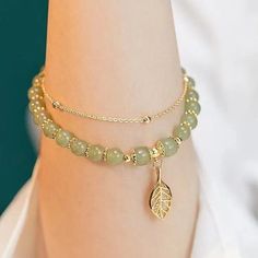 Embrace the Serenity and Elegance of the Hetian Jade Gold Leaf Bracelet A Harmonious Blend of Tradition and Style: In the world of fine jewelry, the Hetian Jade Gold Leaf Bracelet stands as a paragon of elegance and cultural significance. This exquisite bracelet is not just an accessory; it is a symbol of tranquility, prosperity, and the enduring beauty of nature. Ideal for the discerning individual who cherishes both the aesthetic and the meaningful, this bracelet represents a seamless blend of traditional artistry and contemporary design. The Mystique of Hetian Jade: Central to this bracelet’s allure is the Hetian Jade, renowned for its vibrant green hue that has been celebrated throughout history. This cherished stone is more than just visually striking; it is believed to be a powerful Luxury Elegant Green Beaded Bracelets, Luxury Jade Beaded Bracelets With Gemstone Beads, Luxury Silver Jade Bracelets, Elegant Good Luck Bracelets With Natural Stones, Jade Bracelets With Natural Stones For Good Luck, Good Luck Bracelets With Natural Jade Stones, Good Luck Jade Bracelets Spiritual Style, Spiritual Jade Bracelets For Good Luck, Elegant Aventurine Bracelet