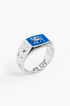 Introducing the Gryphon Ring by Merchants of the Sun, a striking unisex handmade jewelry piece. Crafted with care from 925 recycled sterling silver, this gryphon ring features a captivating design. The addition of blue enamel detailing adds a vibrant touch and makes a bold statement. Elevate your style with the Gryphon Ring, a symbol of exceptional craftsmanship and individuality. Known as a guardian of treasure and a mouthpiece for the sun, the Gryphon epitomises a level of invincible enthusias Enamel Ring, Recycled Silver, Recycled Sterling Silver, Silver Blue, Signet Ring, Statement Ring, Rings Statement, Band Rings, Jewelry Pieces